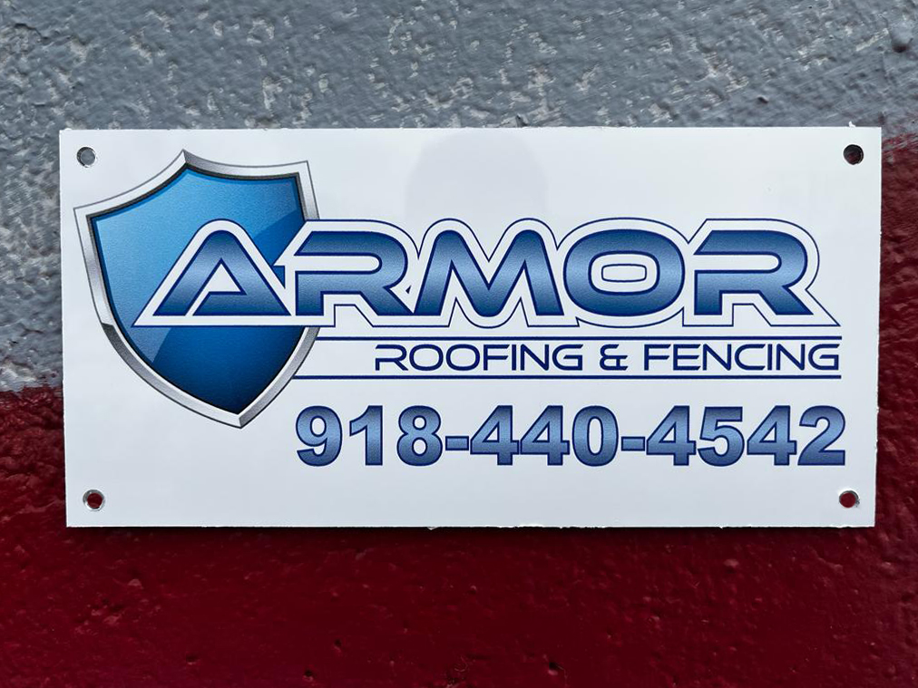 White custom fence sign for Armor Roofing & Fencing with chrome shield logo and phone number 918-440-4542